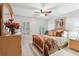 Inviting bedroom with a comfortable bed, neutral tones, shuttered windows, and decorative accents at 1870 Marcia Overlook Dr, Cumming, GA 30041