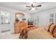 Cozy bedroom featuring a ceiling fan, shutters, neutral color scheme, and warm, inviting textures at 1870 Marcia Overlook Dr, Cumming, GA 30041