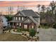 Charming two-story home with a combination of brick and siding, plus landscaped front yard at 1870 Marcia Overlook Dr, Cumming, GA 30041
