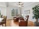 Cozy sitting area with a pair of leather recliner chairs and an abundance of natural light at 1870 Marcia Overlook Dr, Cumming, GA 30041