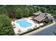 Community pool featuring sun loungers, umbrellas, and a spacious pool deck area by a building at 1870 Marcia Overlook Dr, Cumming, GA 30041