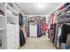 Spacious walk-in closet with custom shelving and hanging racks, providing ample storage and organization at 1870 Marcia Overlook Dr, Cumming, GA 30041