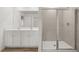 Bathroom featuring glass enclosed shower, double vanity with two sinks and mirror at 321 Daybreak Dr, Acworth, GA 30102