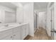 Bathroom with a double vanity, walk-in closet, and glass-enclosed shower at 321 Daybreak Dr, Acworth, GA 30102