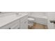 Modern bathroom with a double sink vanity, hardwood flooring, and a soaking tub at 321 Daybreak Dr, Acworth, GA 30102