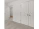 An airy bedroom features neutral carpet and ample closet space with double doors at 321 Daybreak Dr, Acworth, GA 30102