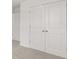 A bright bedroom features neutral colored carpet, white walls and a double door closet at 321 Daybreak Dr, Acworth, GA 30102