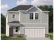 Charming two-story home with light gray siding, a white garage door and lush green landscaping at 321 Daybreak Dr, Acworth, GA 30102