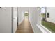 The hallway features wood-look flooring and a window view to the backyard at 321 Daybreak Dr, Acworth, GA 30102