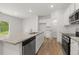 Kitchen with stainless steel appliances, white cabinets and light stone countertops at 321 Daybreak Dr, Acworth, GA 30102