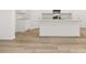 A kitchen island features white cabinets and light stone countertops at 321 Daybreak Dr, Acworth, GA 30102