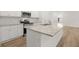 Kitchen with stainless steel appliances, white cabinets and light stone countertops at 321 Daybreak Dr, Acworth, GA 30102