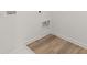 Convenient laundry room with vinyl flooring and hookups at 321 Daybreak Dr, Acworth, GA 30102