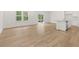 Living room features wood-look flooring and a view to the backyard and kitchen at 321 Daybreak Dr, Acworth, GA 30102