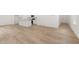 Living room with wood-look floors, and an open concept to the kitchen and island at 321 Daybreak Dr, Acworth, GA 30102