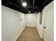 Basement storage room with updated lighting and concrete floors at 438 Holly Nw St, Atlanta, GA 30318