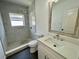 Bathroom with updated vanity, fixtures, and walk in shower at 438 Holly Nw St, Atlanta, GA 30318