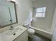 Bathroom with white tile and a shower-tub combo at 438 Holly Nw St, Atlanta, GA 30318