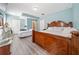Spacious bedroom features hardwood floors, a king bed, and plenty of natural light at 717 Chamberlain Sw Cir, Marietta, GA 30008