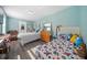 A bedroom with two twin beds, light-blue walls, and plenty of sunshine at 717 Chamberlain Sw Cir, Marietta, GA 30008