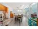 Bright dining area with hardwood floors, complemented by a large table and access to the staircase at 717 Chamberlain Sw Cir, Marietta, GA 30008