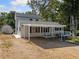 Exterior elevation featuring a well-maintained house with a gravel driveway at 717 Chamberlain Sw Cir, Marietta, GA 30008