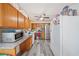 Functional kitchen layout with wooden cabinets, modern appliances, and ample counter space for meal prep at 717 Chamberlain Sw Cir, Marietta, GA 30008