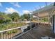 Cozy porch area with wooden floors, railings, and seating at 717 Chamberlain Sw Cir, Marietta, GA 30008
