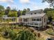 Well-maintained home featuring a spacious back deck and carport, surrounded by a lush garden at 717 Chamberlain Sw Cir, Marietta, GA 30008