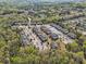 A lush tree canopy and the community's well-planned layout are seen in this aerial shot at 13304 Waldrop Cv, Decatur, GA 30034