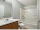 Bathroom featuring a tub/shower combo and a single sink vanity at 13304 Waldrop Cv, Decatur, GA 30034