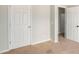Bedroom view showing multiple doors and carpeted floor at 13304 Waldrop Cv, Decatur, GA 30034