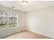 Bedroom view featuring a window and carpeted floors at 13304 Waldrop Cv, Decatur, GA 30034