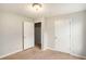 Cozy bedroom view showing closet doors and carpeting at 13304 Waldrop Cv, Decatur, GA 30034