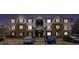 Night-time view of a well lit apartment building with convenient parking in front at 13304 Waldrop Cv, Decatur, GA 30034