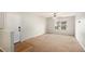Bright living room with neutral walls, carpet floors, and a ceiling fan at 13304 Waldrop Cv, Decatur, GA 30034