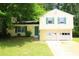 Charming two-story home with a two-car garage, complemented by green shutters at 2238 Scarbrough Dr, Stone Mountain, GA 30088