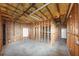 Unfinished basement shows exposed ceiling, framing, and a utility door at 7746 New Castle Way, Jonesboro, GA 30236