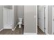 This bathroom has a shower stall, toilet, and a door leading to a hallway at 7746 New Castle Way, Jonesboro, GA 30236