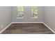 Clean bedroom with hardwood floors and windows, offering a bright and airy atmosphere at 7746 New Castle Way, Jonesboro, GA 30236