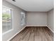 Cozy bedroom featuring hardwood floors and windows, offering a serene and comfortable atmosphere at 7746 New Castle Way, Jonesboro, GA 30236