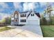Charming two-story home boasts stone accents, a well-manicured lawn, and an attached two-car garage at 7746 New Castle Way, Jonesboro, GA 30236