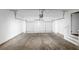 Spacious two-car garage features an automatic door and room for storage at 7746 New Castle Way, Jonesboro, GA 30236