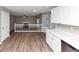 Open-concept living room showcasing hardwood floors, fireplace and bright windows, creating a welcoming and spacious atmosphere at 7746 New Castle Way, Jonesboro, GA 30236