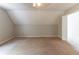 Expansive carpeted bedroom featuring a vaulted ceiling, ceiling fan, and a doorway offering easy access to other rooms at 116 Shefield Pl, Douglasville, GA 30134