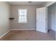 Bedroom featuring carpet flooring, a window, a closet, and neutral wall paint at 116 Shefield Pl, Douglasville, GA 30134