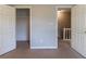 Bedroom space with neutral walls, carpet flooring, and access to a closet at 116 Shefield Pl, Douglasville, GA 30134
