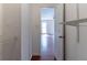 Walk-in closet featuring wire shelving and hardwood floors extending into an adjacent bedroom with natural light at 116 Shefield Pl, Douglasville, GA 30134