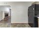 View from kitchen featuring appliances, a fireplace and updated flooring in the connected living area at 116 Shefield Pl, Douglasville, GA 30134