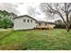 Exterior backyard view of home with a deck and green grass at 1741 Hasty Rd, Marietta, GA 30062